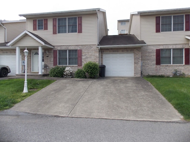 260 Donna Ave, Morgantown, WV 26505 - view of front of property with brick siding, a garage, a front yard, and concrete driveway