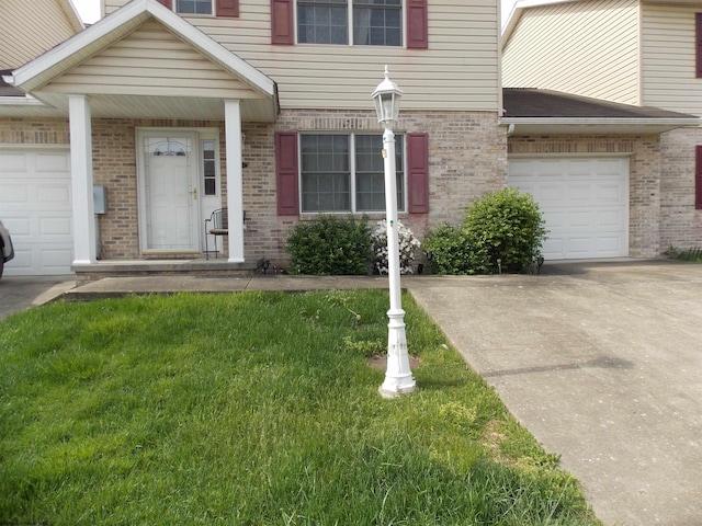 260 Donna Ave, Morgantown, WV 26505 - view of front facade featuring brick siding, driveway, and a front lawn