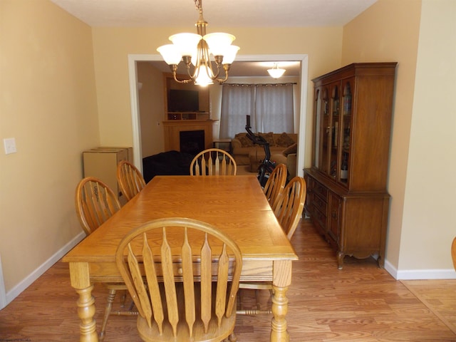 260 Donna Ave, Morgantown, WV 26505 - dining area with an inviting chandelier, baseboards, and light wood-style flooring