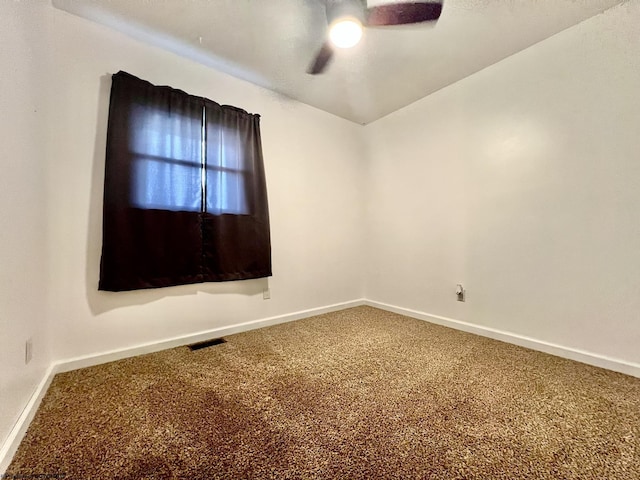 unfurnished room featuring carpet floors, baseboards, ceiling fan, and visible vents