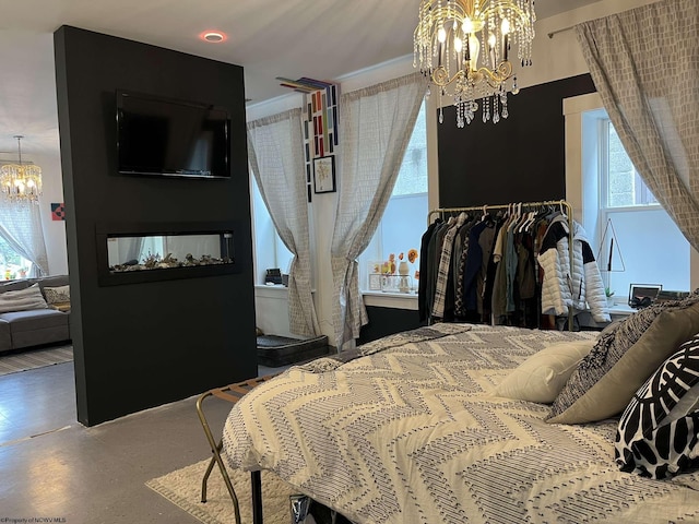 bedroom with a notable chandelier