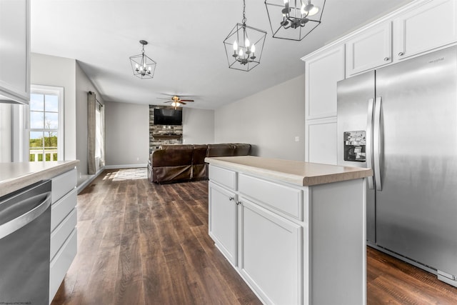 245 Charolais Cir, Fairmont, WV 26554 - kitchen with ceiling fan with notable chandelier, dark wood finished floors, white cabinets, hanging light fixtures, and appliances with stainless steel finishes