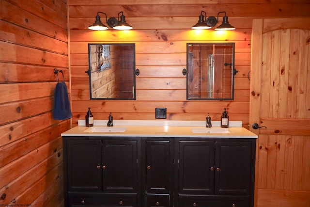 bathroom featuring wooden walls, double vanity, and a sink