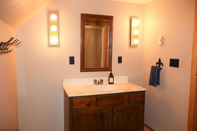 bathroom with a shower and vanity