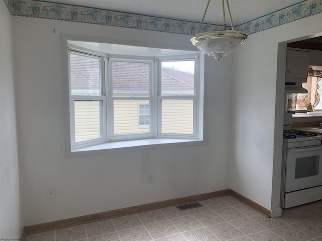 108 4th St, Spelter, WV 26438 - unfurnished dining area featuring baseboards, a wealth of natural light, light tile patterned floors, and visible vents