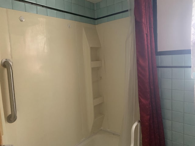 108 4th St, Spelter, WV 26438 - bathroom featuring tile walls and shower / tub combo with curtain