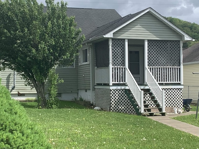 108 4th St, Spelter, WV 26438 - view of front of property with covered porch, a shingled roof, and a front lawn