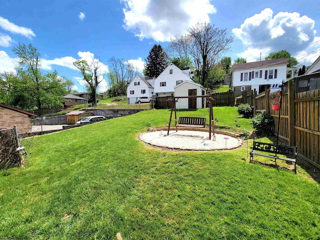 view of yard with a residential view and a fenced backyard
