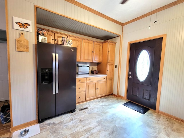 kitchen with refrigerator with ice dispenser, visible vents, baseboards, light countertops, and ornamental molding