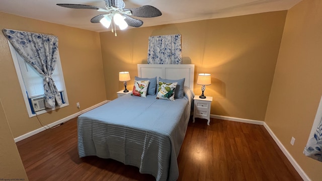 bedroom featuring baseboards, cooling unit, a ceiling fan, and wood finished floors