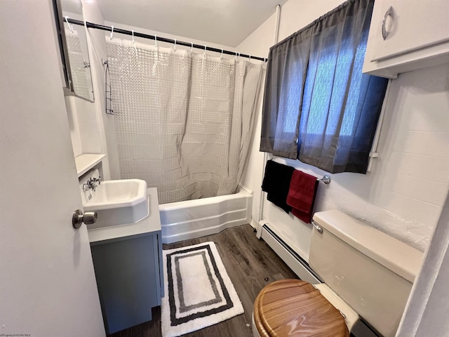 bathroom featuring toilet, wood finished floors, vanity, baseboard heating, and shower / bath combination with curtain