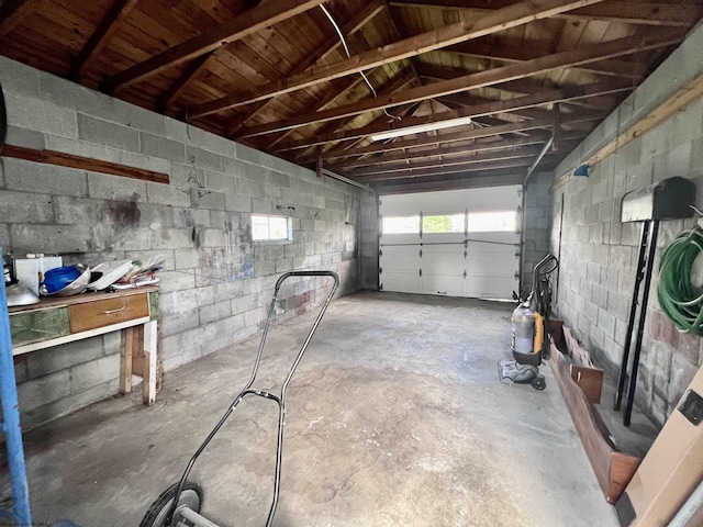 garage with concrete block wall