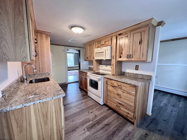 kitchen featuring a sink, ornamental molding, white appliances, and dark wood finished floors