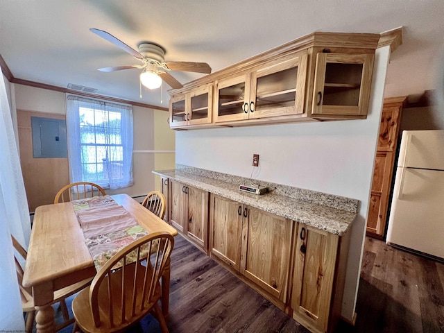 kitchen with freestanding refrigerator, a ceiling fan, glass insert cabinets, electric panel, and dark wood-type flooring