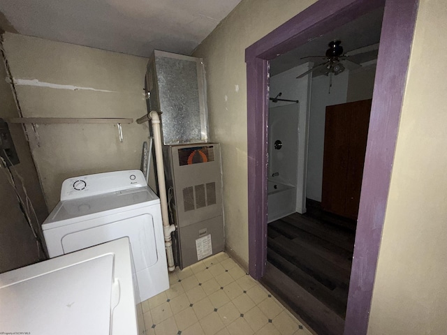 laundry room featuring laundry area, light floors, a ceiling fan, and independent washer and dryer