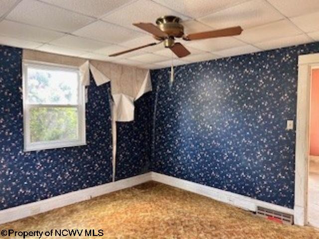 530 Newton St, Fairmont, WV 26554 - spare room with wallpapered walls, a drop ceiling, and baseboards