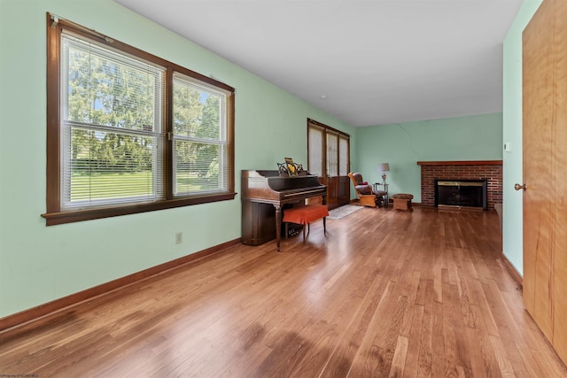 1060 Takoma St, Morgantown, WV 26505 - living area with a brick fireplace, baseboards, and wood finished floors