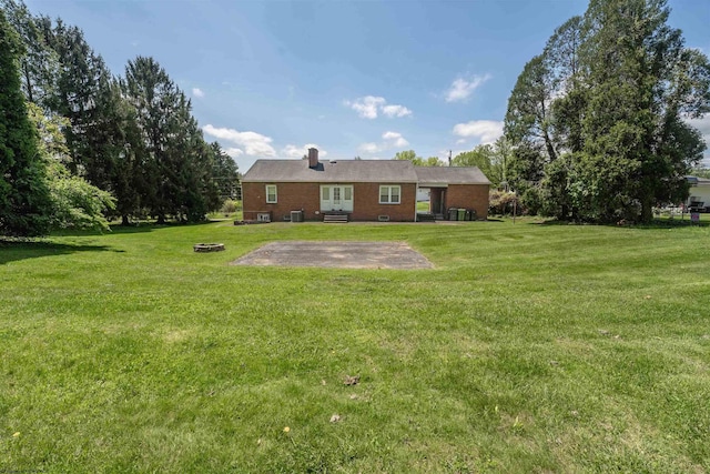 1060 Takoma St, Morgantown, WV 26505 - rear view of property with a patio, brick siding, and a lawn