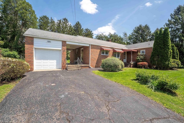 1060 Takoma St, Morgantown, WV 26505 - ranch-style home with aphalt driveway, an attached garage, a front lawn, and brick siding