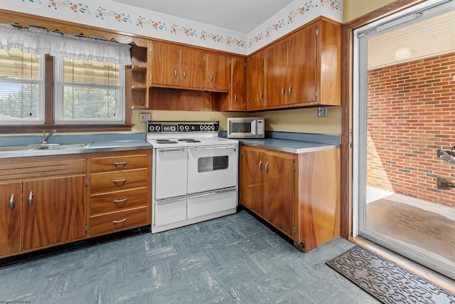 1060 Takoma St, Morgantown, WV 26505 - kitchen with a sink, brown cabinetry, white appliances, dark floors, and light countertops