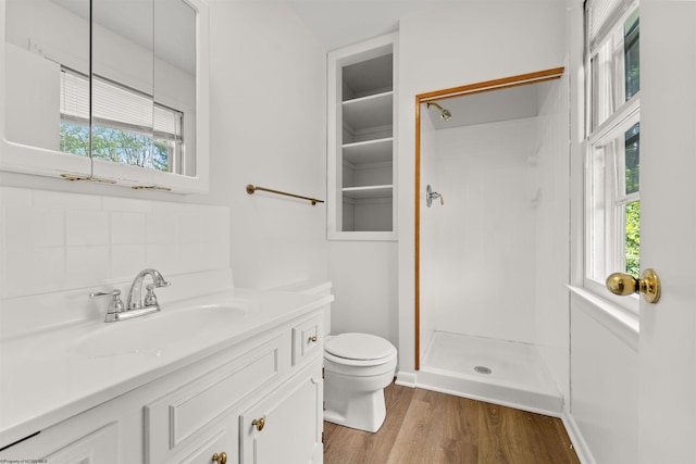 277 Randolph Rd, Morgantown, WV 26505 - full bath with toilet, wood finished floors, vanity, a stall shower, and decorative backsplash