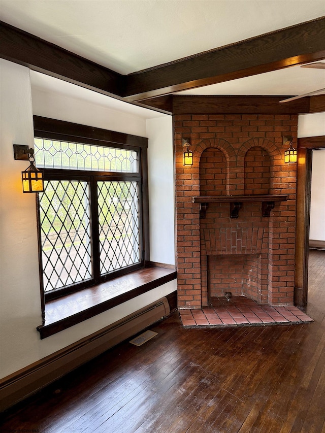 108 Marshall St, Mannington, WV 26582 - unfurnished living room with wood-type flooring, beam ceiling, baseboard heating, a fireplace, and baseboards