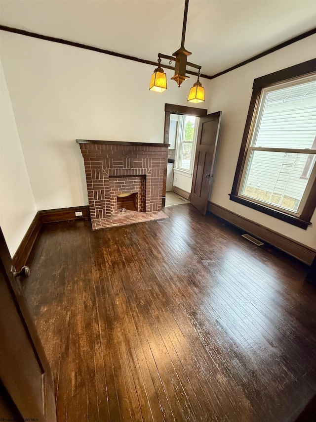 108 Marshall St, Mannington, WV 26582 - unfurnished living room featuring hardwood / wood-style floors, a brick fireplace, baseboards, and ornamental molding