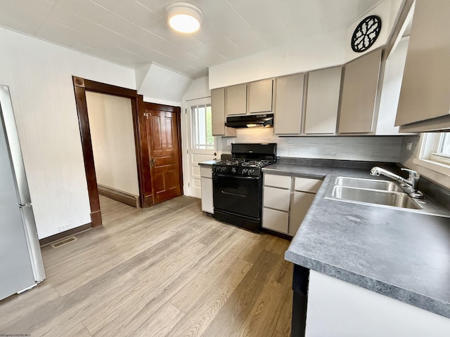 108 Marshall St, Mannington, WV 26582 - kitchen featuring gas stove, under cabinet range hood, a sink, and healthy amount of natural light