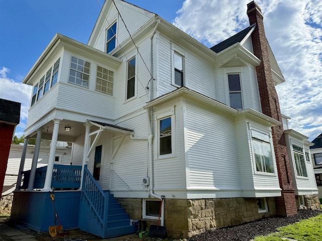 108 Marshall St, Mannington, WV 26582 - view of side of property with a chimney and a porch