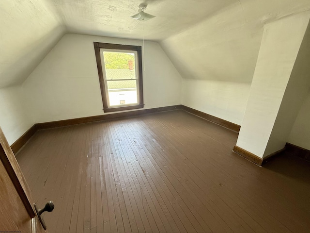 108 Marshall St, Mannington, WV 26582 - bonus room with vaulted ceiling, dark wood finished floors, and baseboards