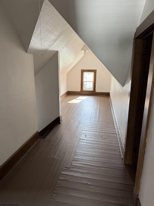 108 Marshall St, Mannington, WV 26582 - additional living space featuring hardwood / wood-style floors, lofted ceiling, and baseboards