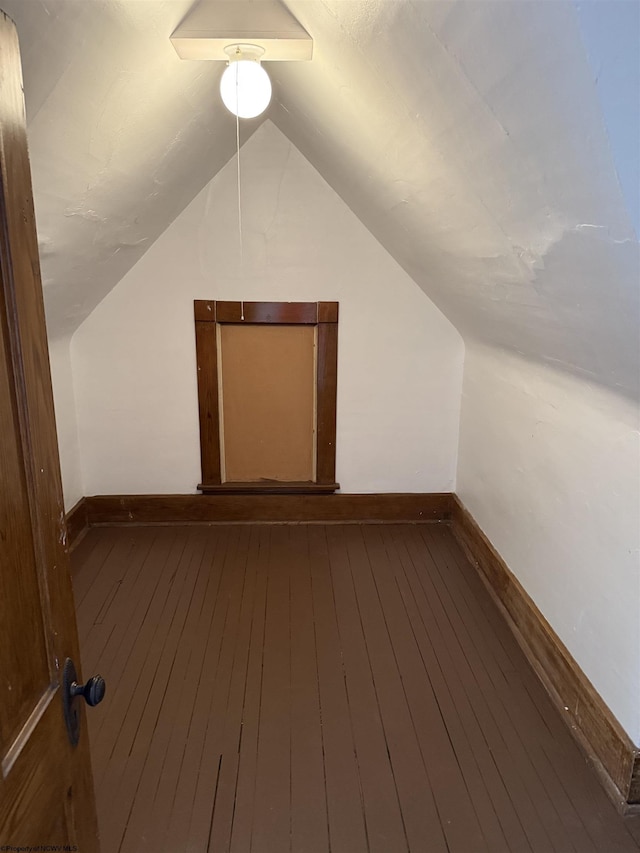 108 Marshall St, Mannington, WV 26582 - additional living space featuring baseboards, wood-type flooring, and vaulted ceiling