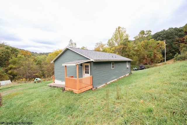 2081 Plum Run Rd, Mannington, WV 26582 - rear view of property featuring a lawn and a forest view