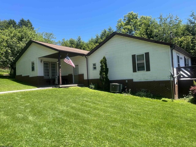 36 3rd St, Durbin, WV 26264 - back of property featuring cooling unit and a lawn