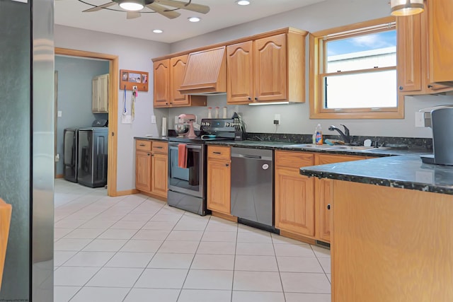 16 Cardinal Ln, Terra Alta, WV 26764 - kitchen featuring appliances with stainless steel finishes, a sink, custom exhaust hood, separate washer and dryer, and light tile patterned flooring