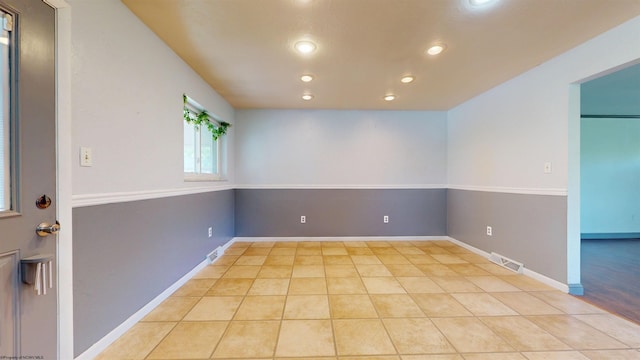 spare room with recessed lighting, light tile patterned floors, and baseboards