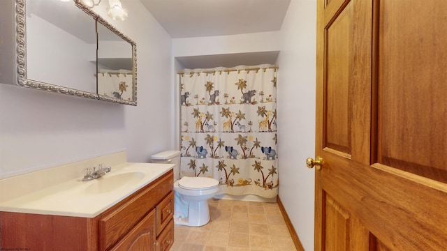 bathroom featuring toilet and vanity