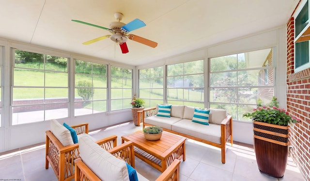 sunroom / solarium featuring an outdoor hangout area and a ceiling fan