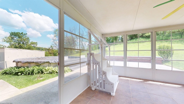 sunroom featuring healthy amount of natural light