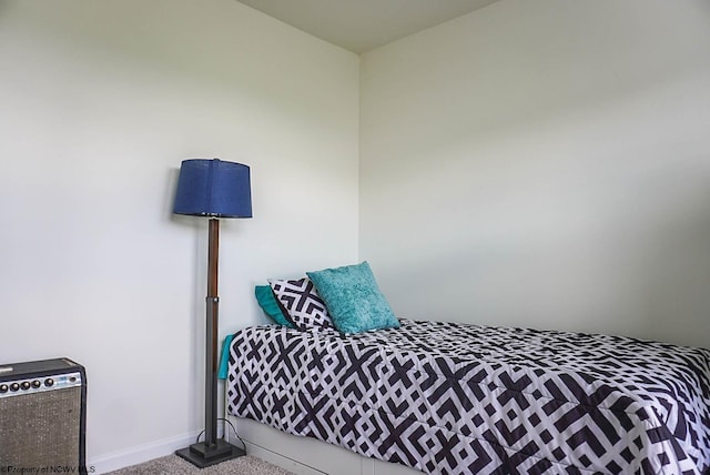 bedroom featuring carpet flooring and baseboards