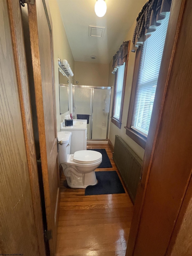 155 E St, Masontown, WV 26542 - bathroom with an enclosed shower, toilet, and wood finished floors