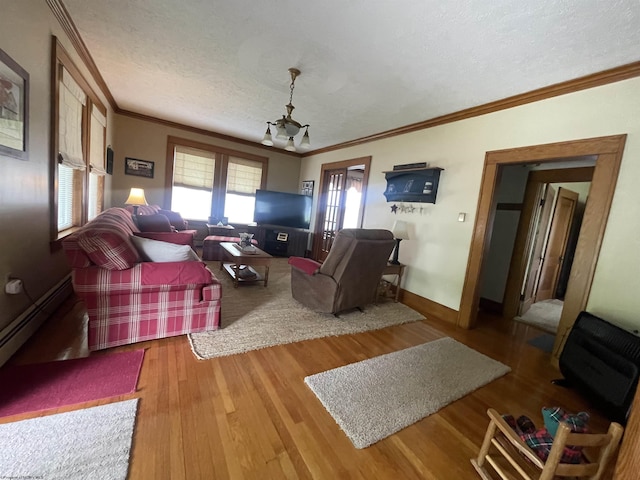 155 E St, Masontown, WV 26542 - living area featuring ornamental molding, wood finished floors, baseboards, a textured ceiling, and a chandelier