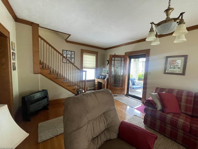 155 E St, Masontown, WV 26542 - living room featuring stairs, wood finished floors, crown molding, and heating unit