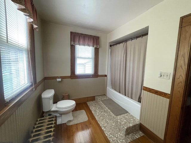 155 E St, Masontown, WV 26542 - bathroom with wainscoting, radiator, toilet, wood finished floors, and shower / bath combo with shower curtain