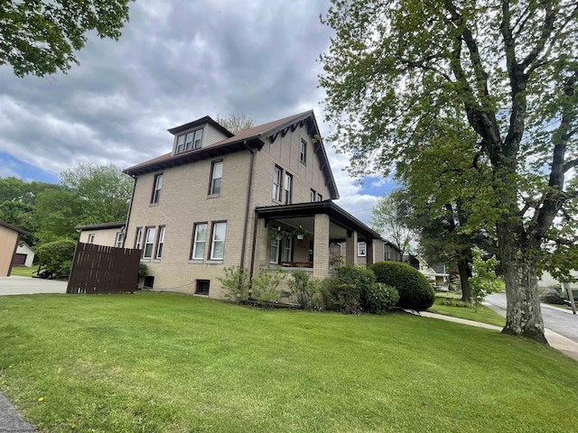 155 E St, Masontown, WV 26542 - view of home's exterior with a lawn and brick siding