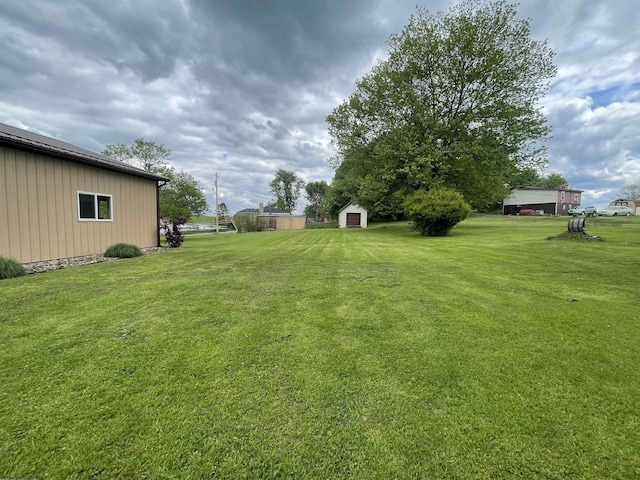 155 E St, Masontown, WV 26542 - view of green lawn featuring an outdoor structure and a storage shed