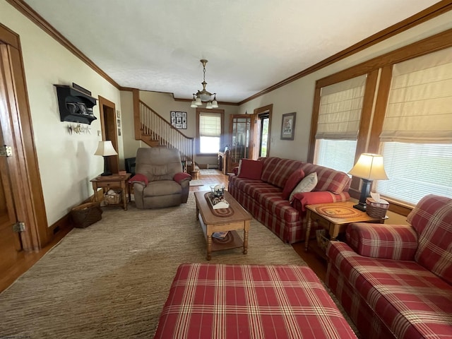 155 E St, Masontown, WV 26542 - living room featuring crown molding, a chandelier, wood finished floors, and baseboards