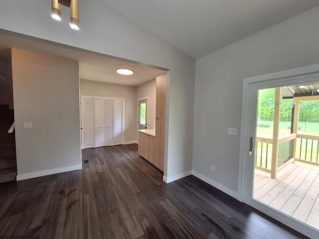 794 Laurel Park Rd, Clarksburg, WV 26301 - unfurnished room with plenty of natural light, dark wood-style flooring, baseboards, and vaulted ceiling