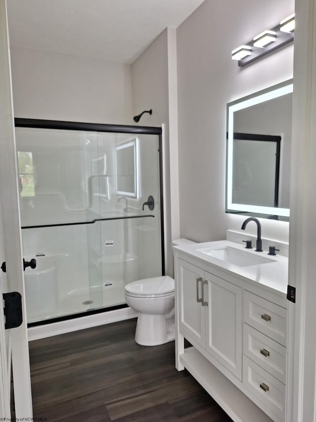 794 Laurel Park Rd, Clarksburg, WV 26301 - bathroom with wood finished floors, a stall shower, toilet, and vanity