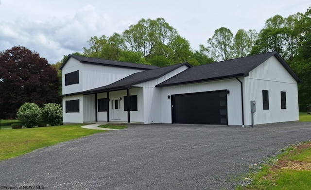 794 Laurel Park Rd, Clarksburg, WV 26301 - modern farmhouse with a garage, gravel driveway, and a front lawn